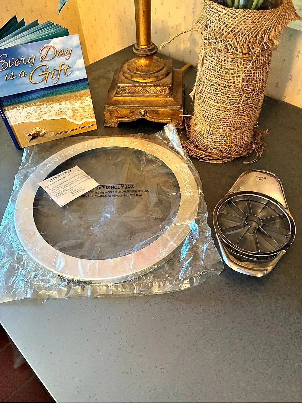 1 NEW IN PACKAGE, Band Wagon’s pie crust shield and 1 Pampered Chef apple wedge